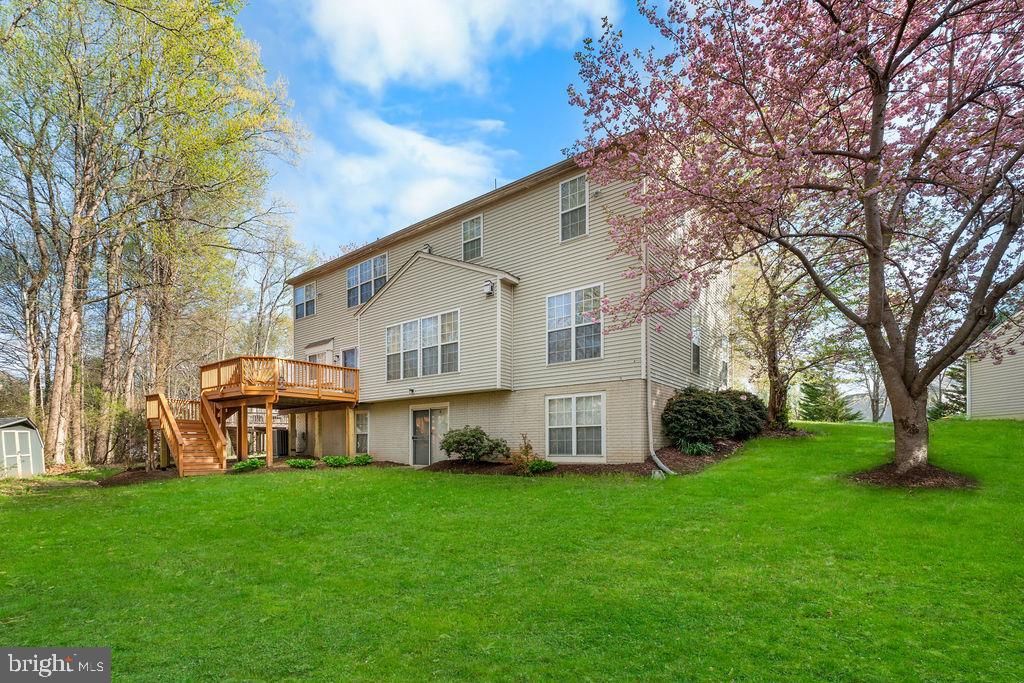 14701 Danton Court Bowie, MD 20721 - Photo 4 of 60 a view of a house with backyard and a tree