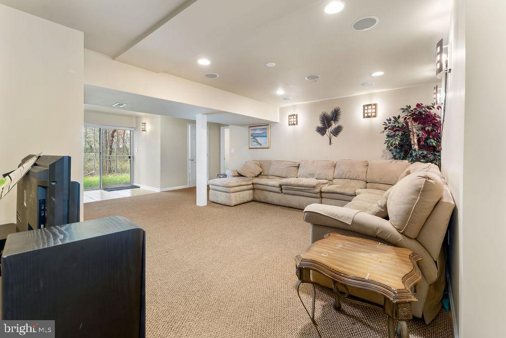 14701 Danton Court Bowie, MD 20721 - Photo 43 of 60 a living room with furniture and a flat screen tv