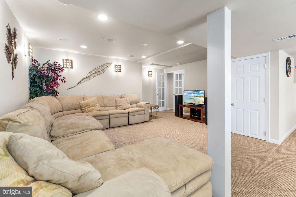 14701 Danton Court Bowie, MD 20721 - Photo 44 of 60 a living room with furniture and a flat screen tv