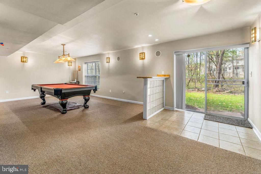 14701 Danton Court Bowie, MD 20721 - Photo 46 of 60 a living room with furniture and a floor to ceiling window