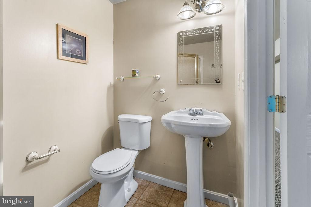 14701 Danton Court Bowie, MD 20721 - Photo 53 of 60 a bathroom with a toilet sink and mirror