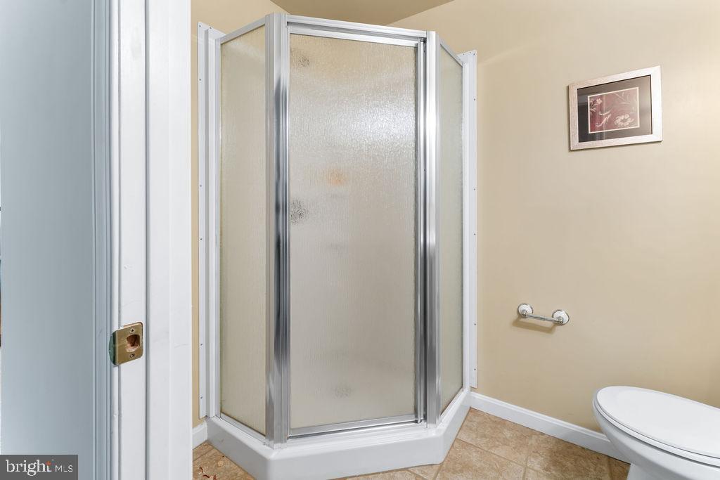 14701 Danton Court Bowie, MD 20721 - Photo 54 of 60 a bathroom with a glass shower door