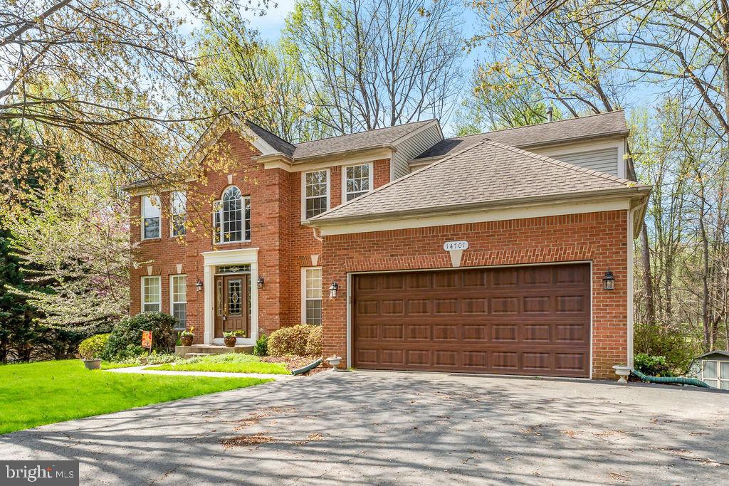 14701 Danton Court Bowie, MD 20721 - Photo 57 of 60 a front view of a house with a yard and garage