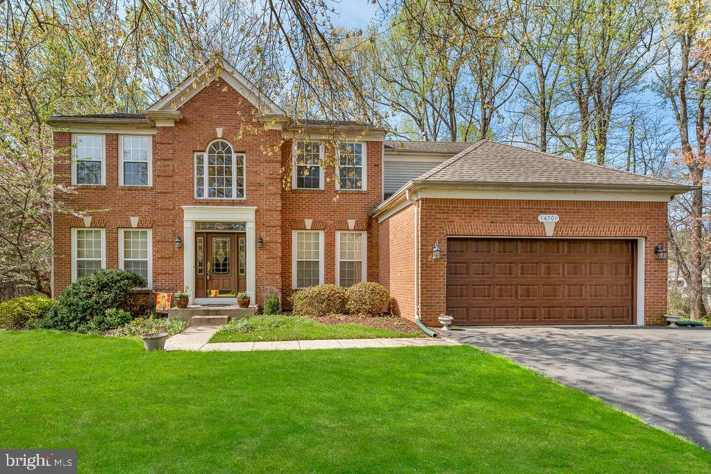 14701 Danton Court Bowie, MD 20721 - Photo 58 of 60 a front view of a house with a yard and garage