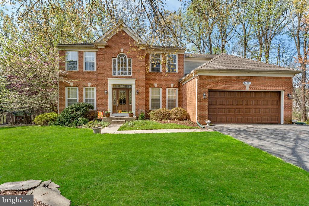 14701 Danton Court Bowie, MD 20721 - Photo 59 of 60 a front view of a house with a yard and garage