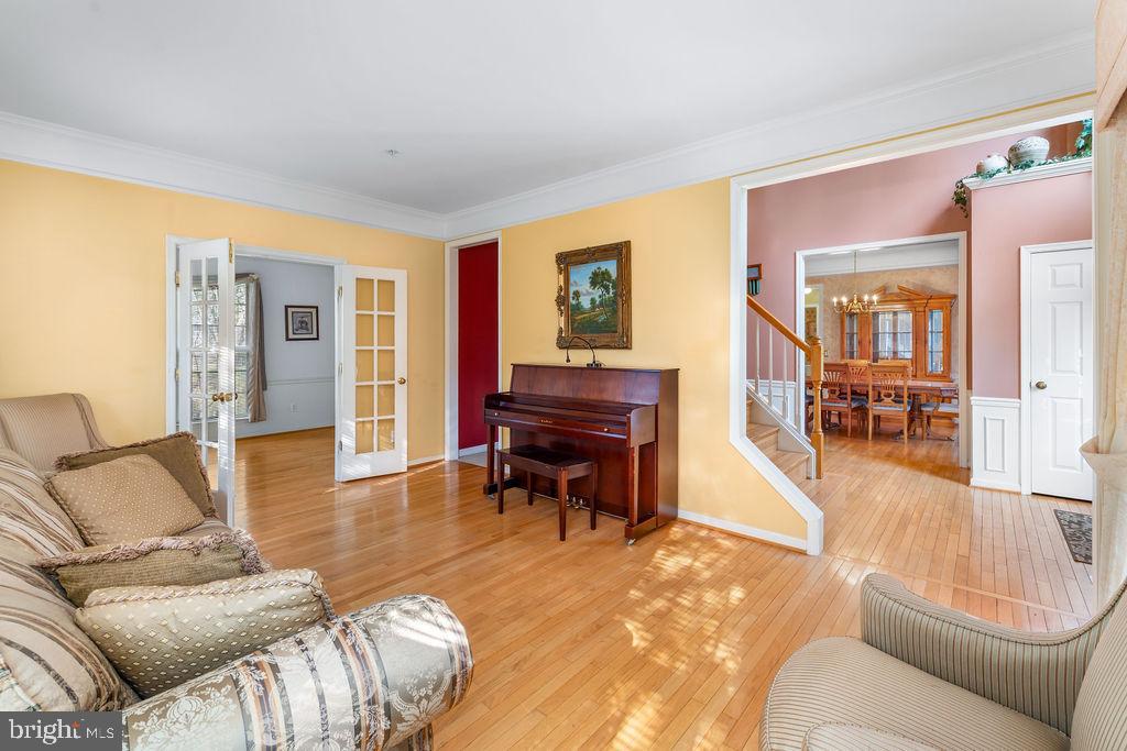 14701 Danton Court Bowie, MD 20721 - Photo 7 of 60 a living room with furniture and a wooden floor