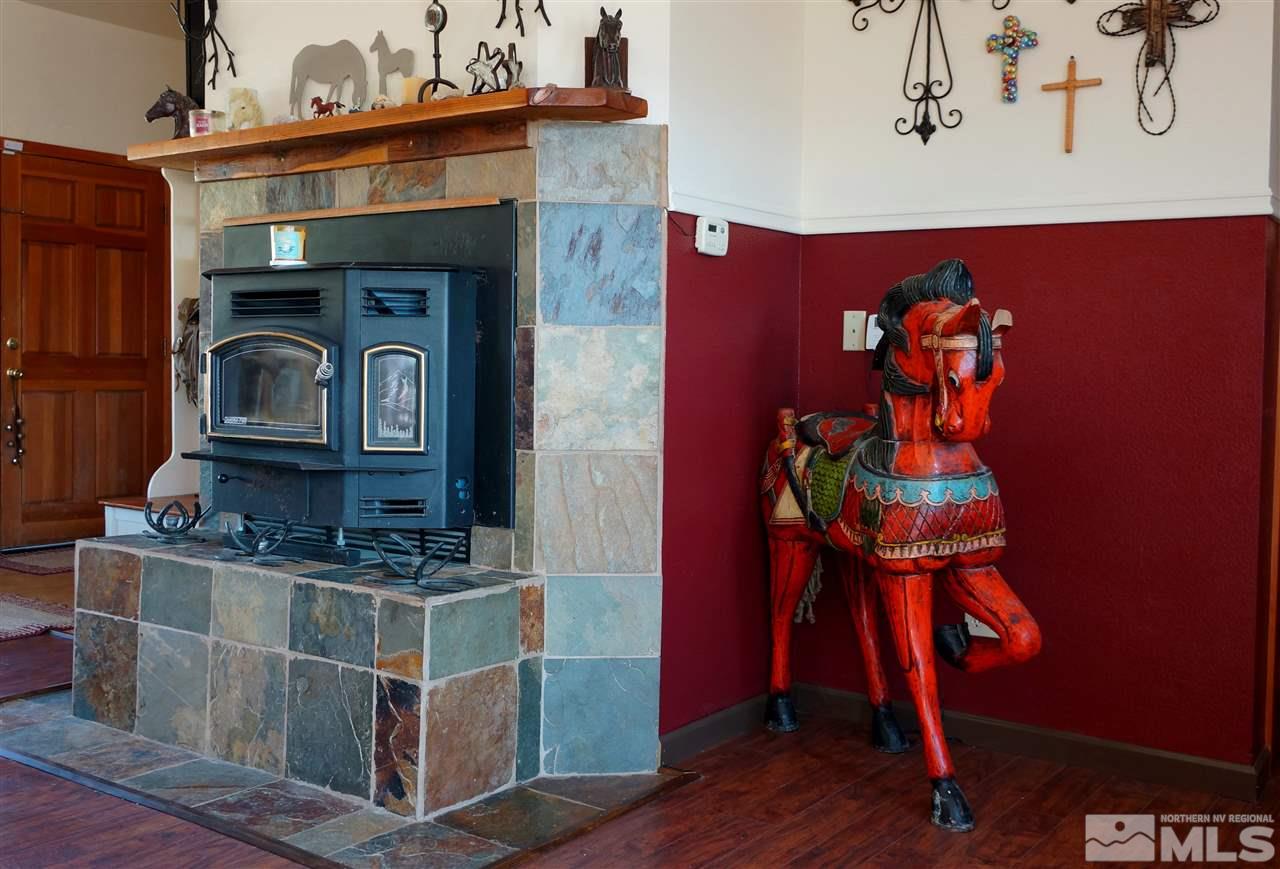 5200 Twin Springs Road Reno, NV 89510 - Photo 9 of 23 a front view of a fireplace with wooden floor