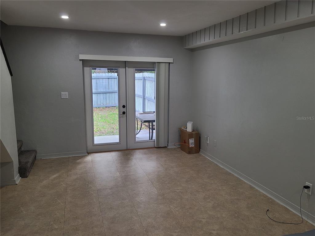 4123 Southwest 15 Place, Unit 2 Gainesville, FL 32607 - Photo 14 of 14 an empty room with windows