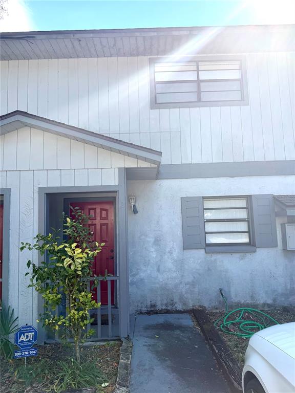 4123 Southwest 15 Place, Unit 2 Gainesville, FL 32607 - Photo 2 of 14 a front view of a house with a yard
