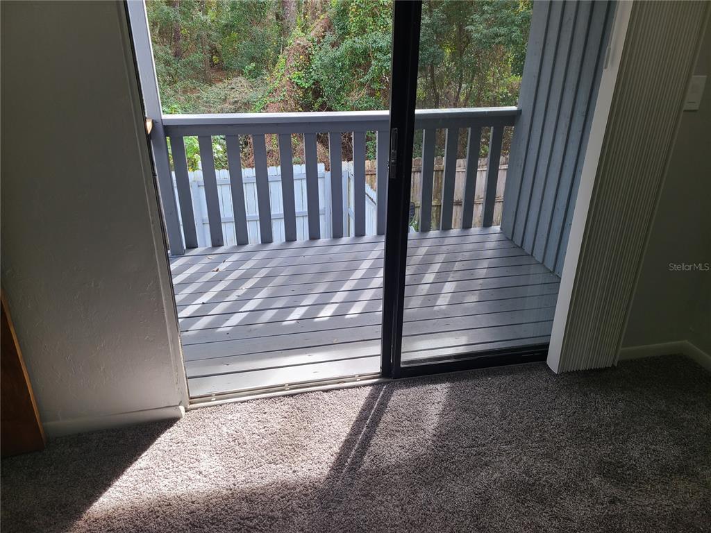 4123 Southwest 15 Place, Unit 2 Gainesville, FL 32607 - Photo 6 of 14 a view of a door in the house