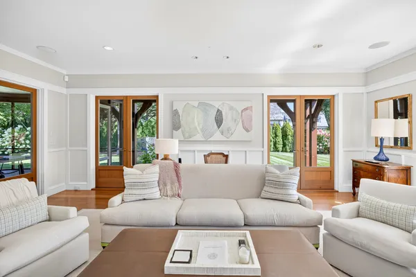 a living room with kitchen island furniture and a wooden floor