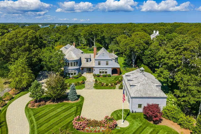 an aerial view of a house with a garden and yard