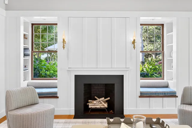 a kitchen with granite countertop a sink dishwasher stove and cabinets with wooden floor
