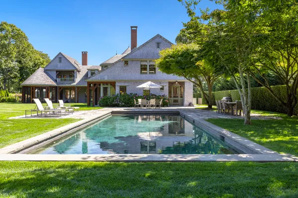 a front view of a house with a swimming pool
