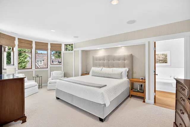 a bedroom with a bed and a couch