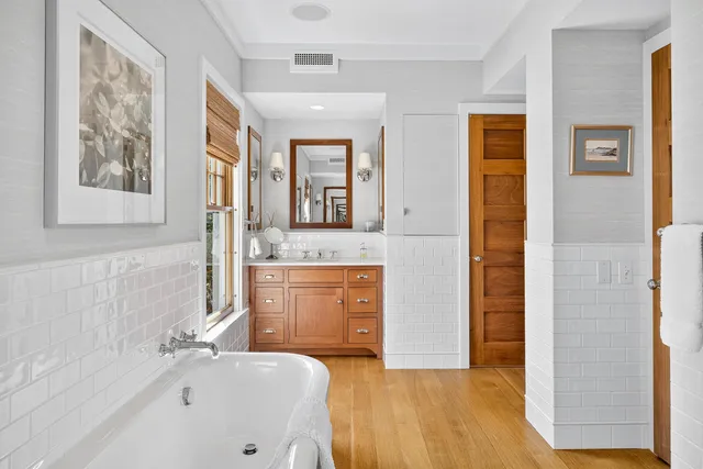 a bathroom with a bathtub and shower