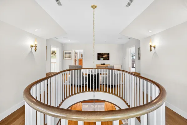 a picture of a room with a white wall and a painting