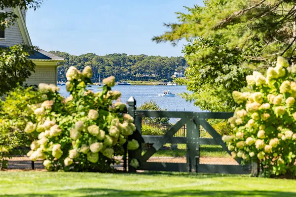 a picture of a room with a white wall and a painting