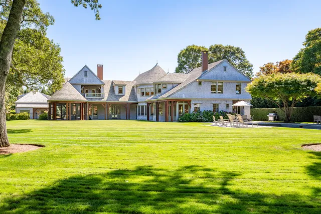 a front view of a house with a swimming pool