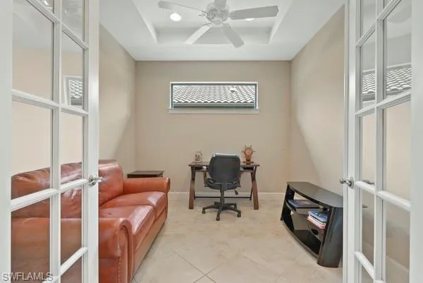 a view of a livingroom with workspace and a couch