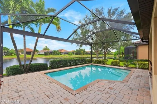 a view of a swimming pool with a patio