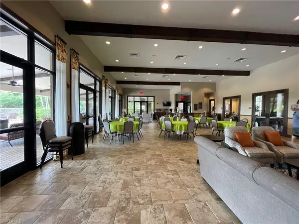 a lobby with furniture and floor to ceiling window