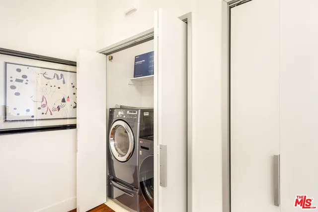 a dining room with furniture and a wooden floor