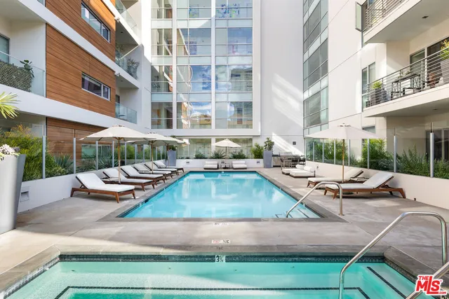 a kitchen with stainless steel appliances kitchen island granite countertop a stove and a granite counter top
