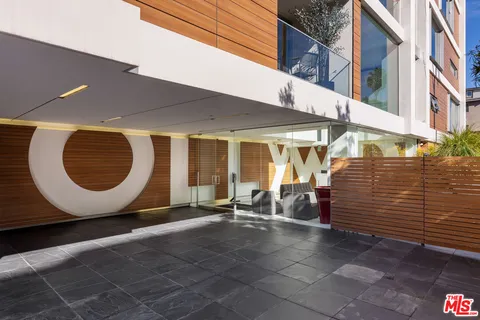 a view of a building with sitting area