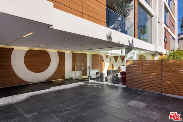 a view of a building with sitting area