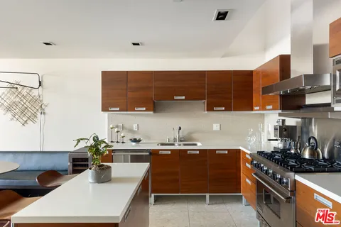 a kitchen with a table and chairs in it