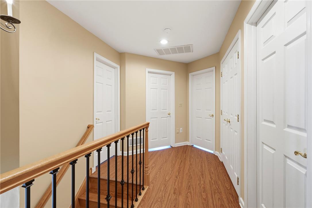 590 Fehr Road Nazareth, PA 18064 - Photo 29 of 79 Gleaming hardwood floors and a wooden banister lead into a functional upper-level hallway.
