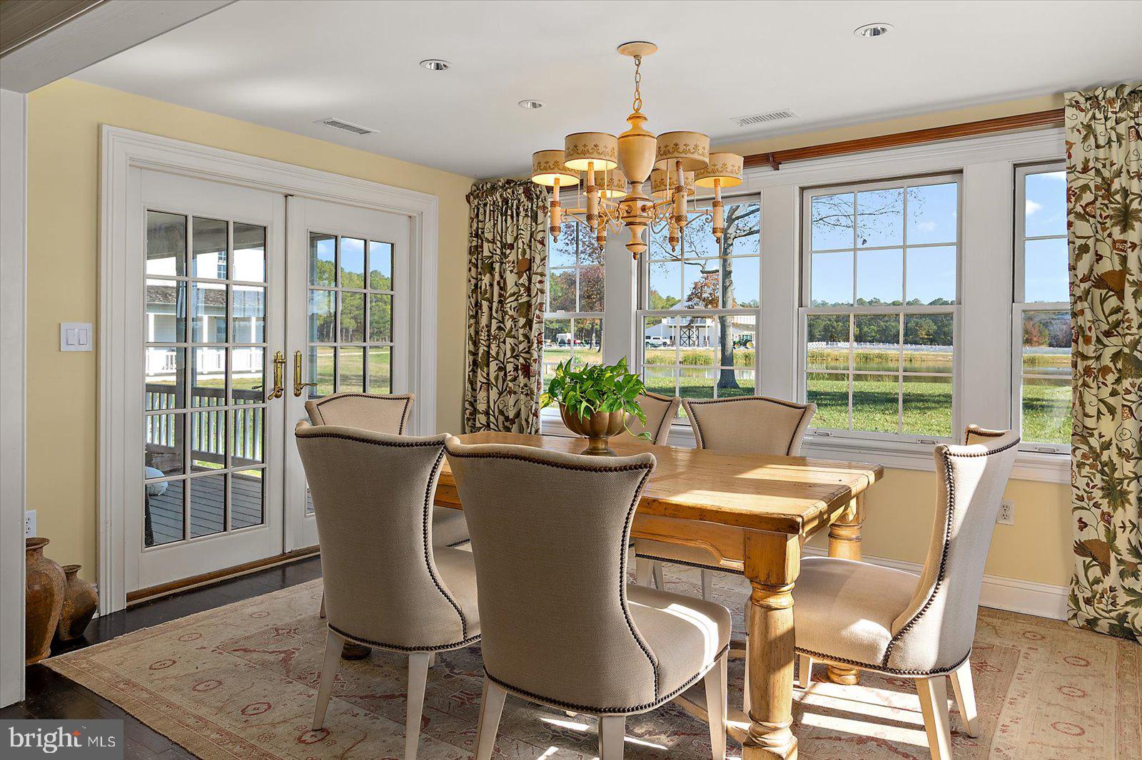964 Taylors Island Road Madison, MD 21648 - Photo 23 of 106 a view of a dining room with furniture window and outside view