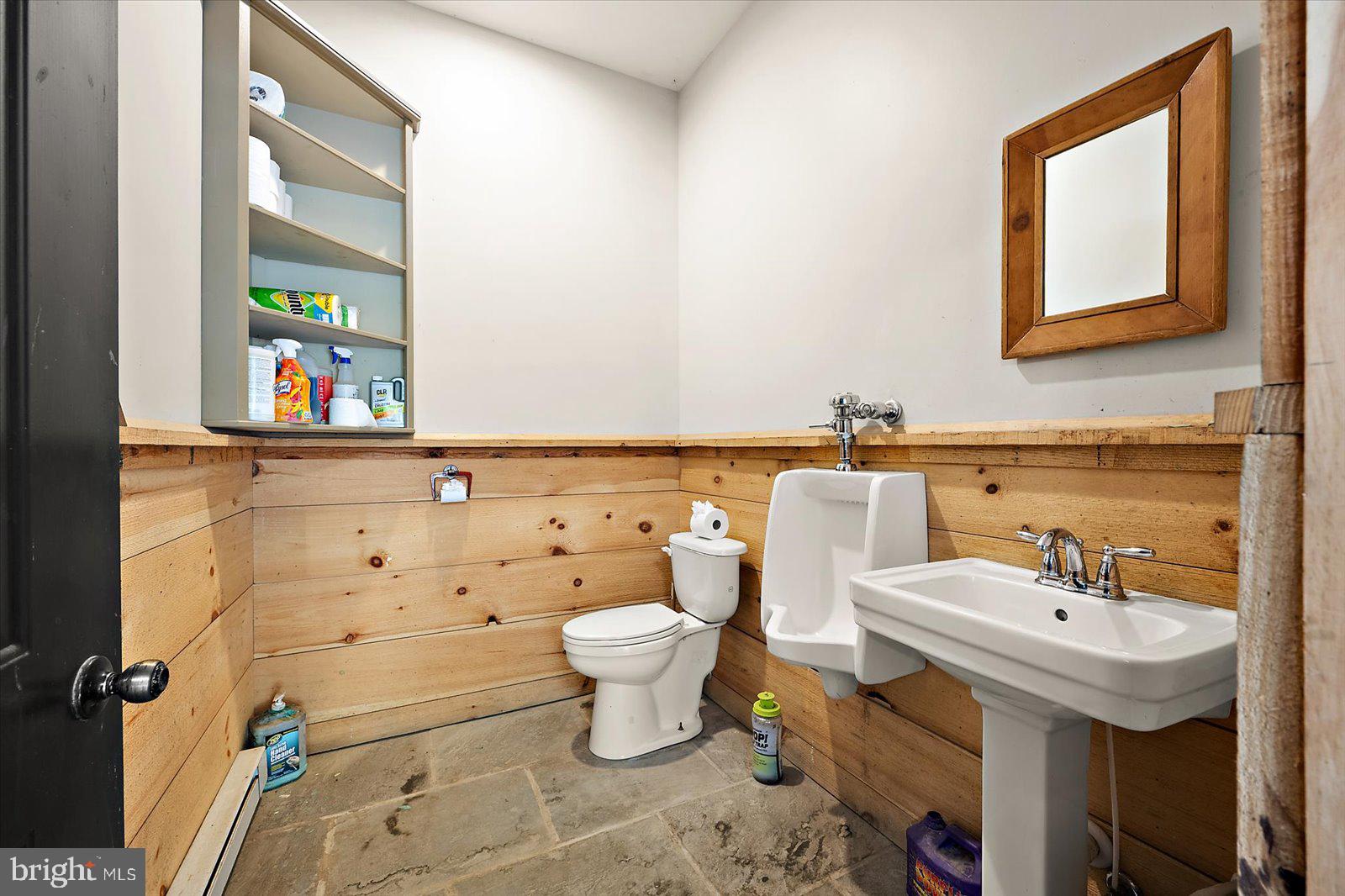 964 Taylors Island Road Madison, MD 21648 - Photo 54 of 106 a bathroom with a sink toilet and mirror