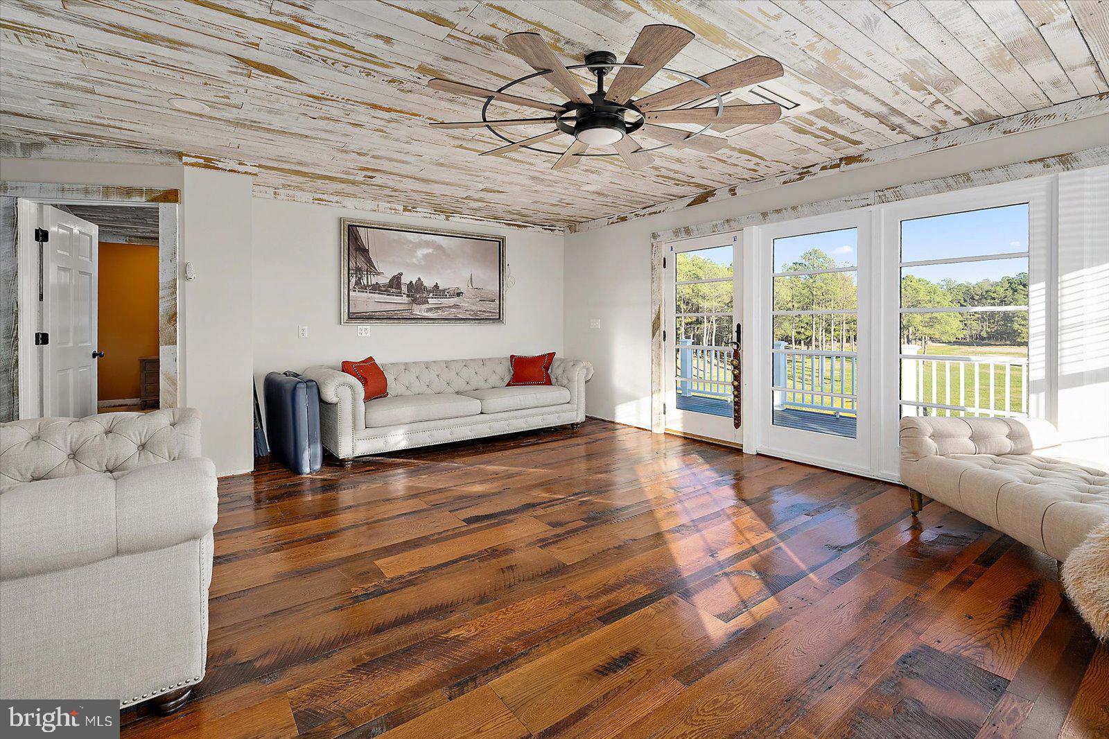 964 Taylors Island Road Madison, MD 21648 - Photo 64 of 106 a living room with furniture and wooden floor