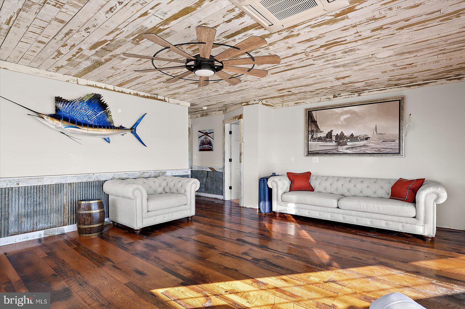 964 Taylors Island Road Madison, MD 21648 - Photo 65 of 106 a living room with furniture and a wooden floor