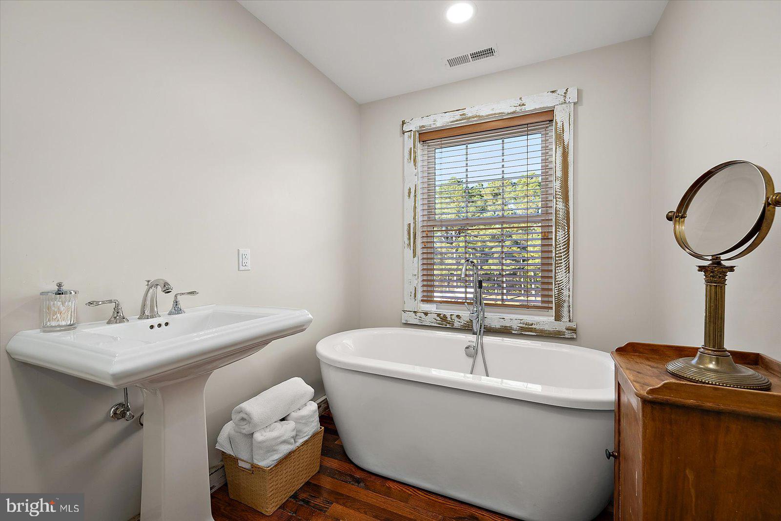 964 Taylors Island Road Madison, MD 21648 - Photo 68 of 106 a white bath tub sitting next to a white sink