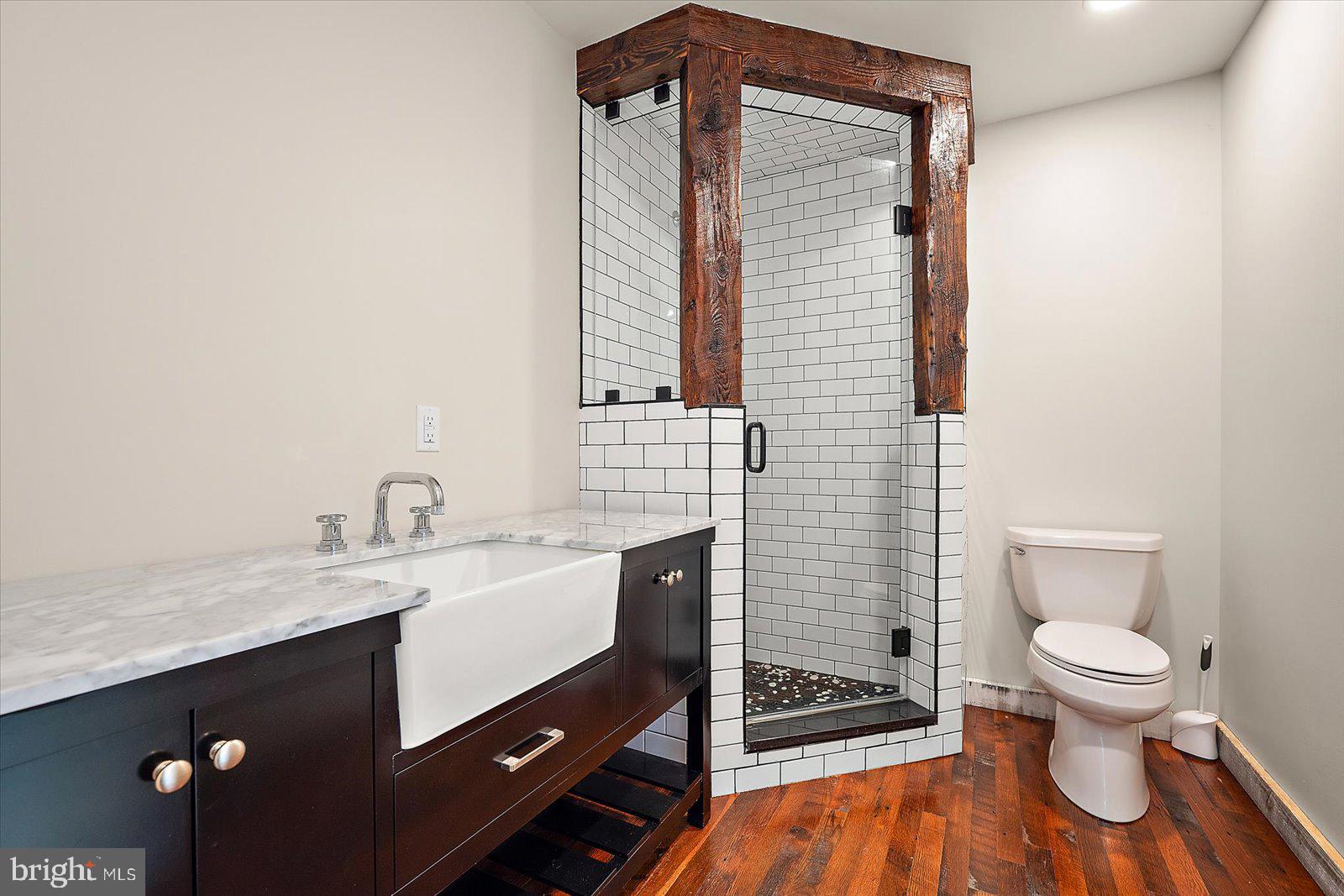 964 Taylors Island Road Madison, MD 21648 - Photo 71 of 106 a bathroom with a sink a toilet and shower