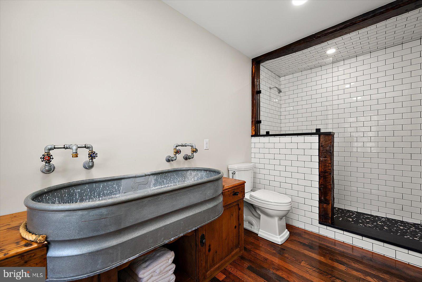 964 Taylors Island Road Madison, MD 21648 - Photo 75 of 106 a bathroom with a toilet and a sink