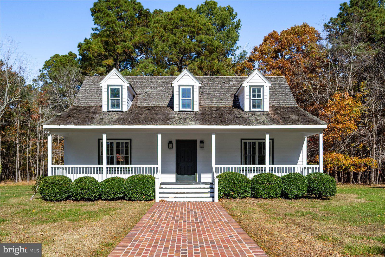 964 Taylors Island Road Madison, MD 21648 - Photo 76 of 106 a front view of a house with yard and green space
