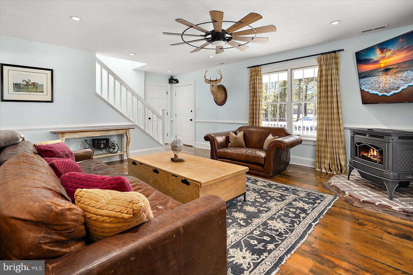 964 Taylors Island Road Madison, MD 21648 - Photo 77 of 106 a living room with furniture fireplace and flat screen tv