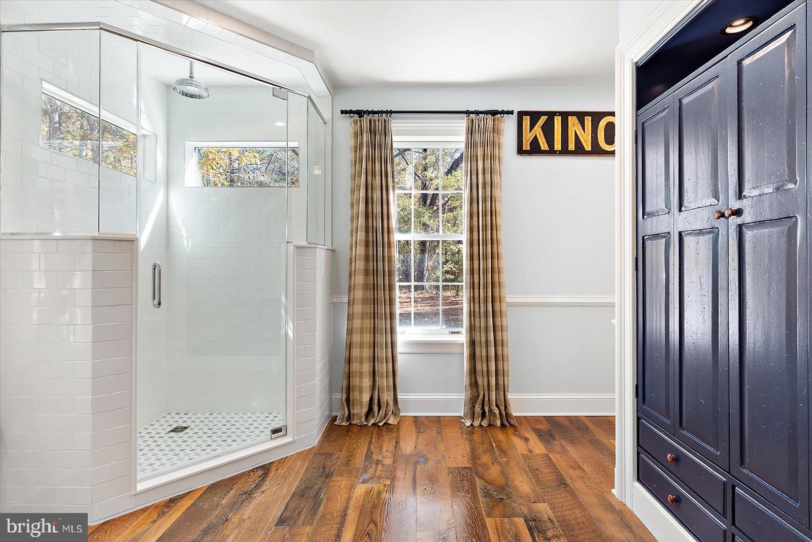 964 Taylors Island Road Madison, MD 21648 - Photo 87 of 106 a view of an empty room with wooden floor and a window