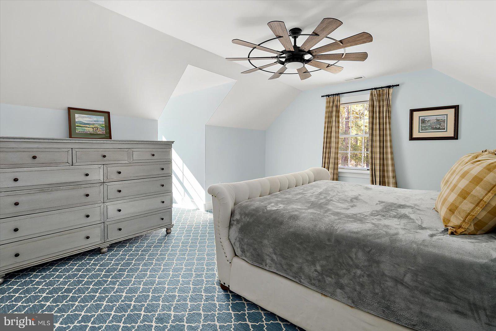 964 Taylors Island Road Madison, MD 21648 - Photo 91 of 106 a bedroom with a bed and a table