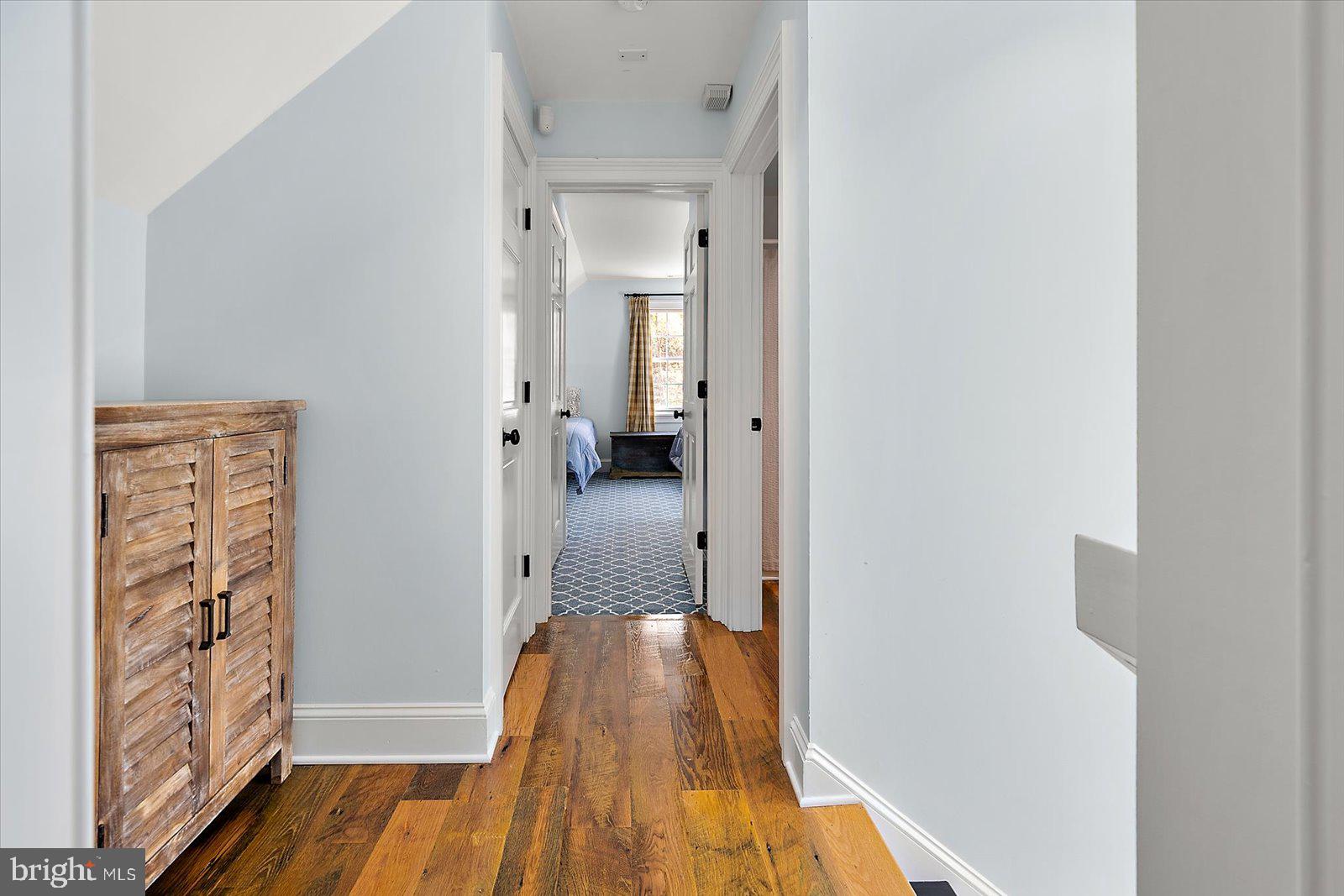 964 Taylors Island Road Madison, MD 21648 - Photo 92 of 106 a view of a hallway with wooden floor and closet