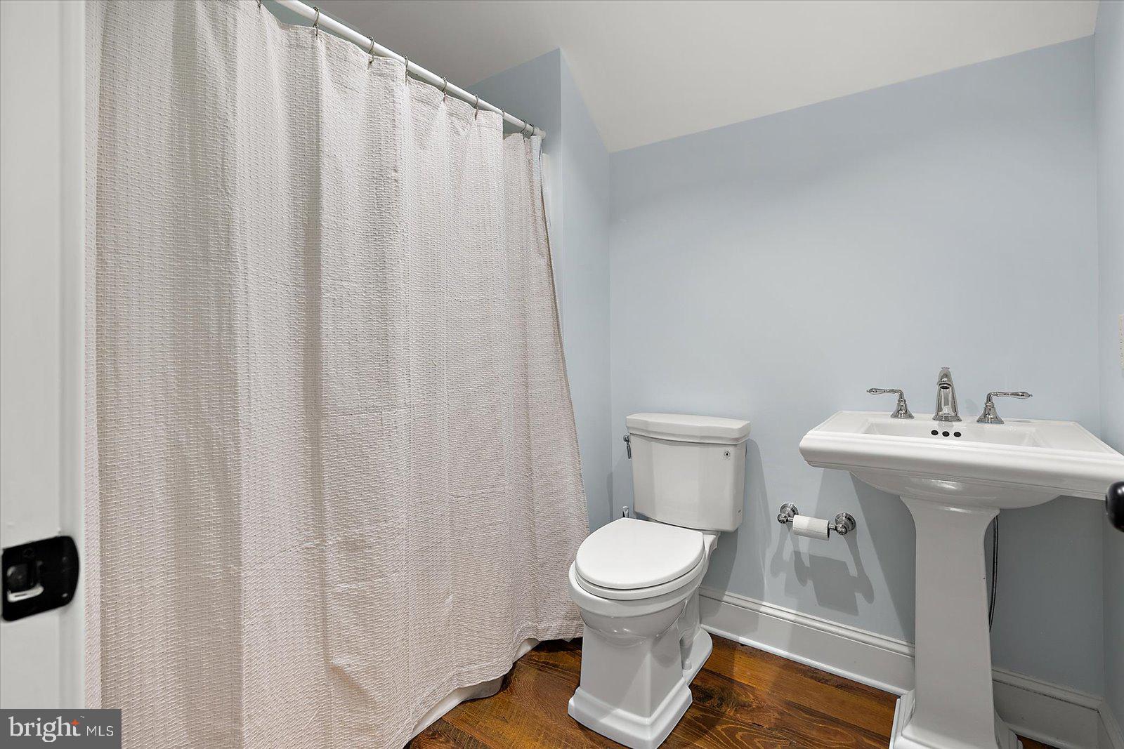 964 Taylors Island Road Madison, MD 21648 - Photo 93 of 106 a bathroom with a sink a toilet and a mirror