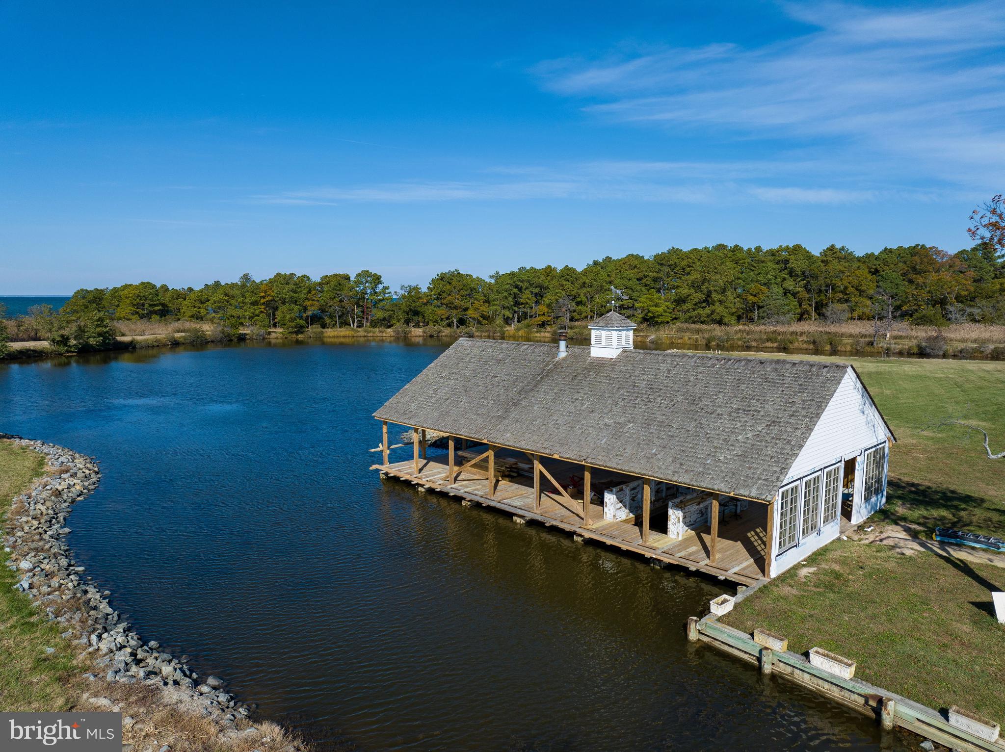 964 Taylors Island Road Madison, MD 21648 - Photo 99 of 106 an aerial view of a house with a lake view