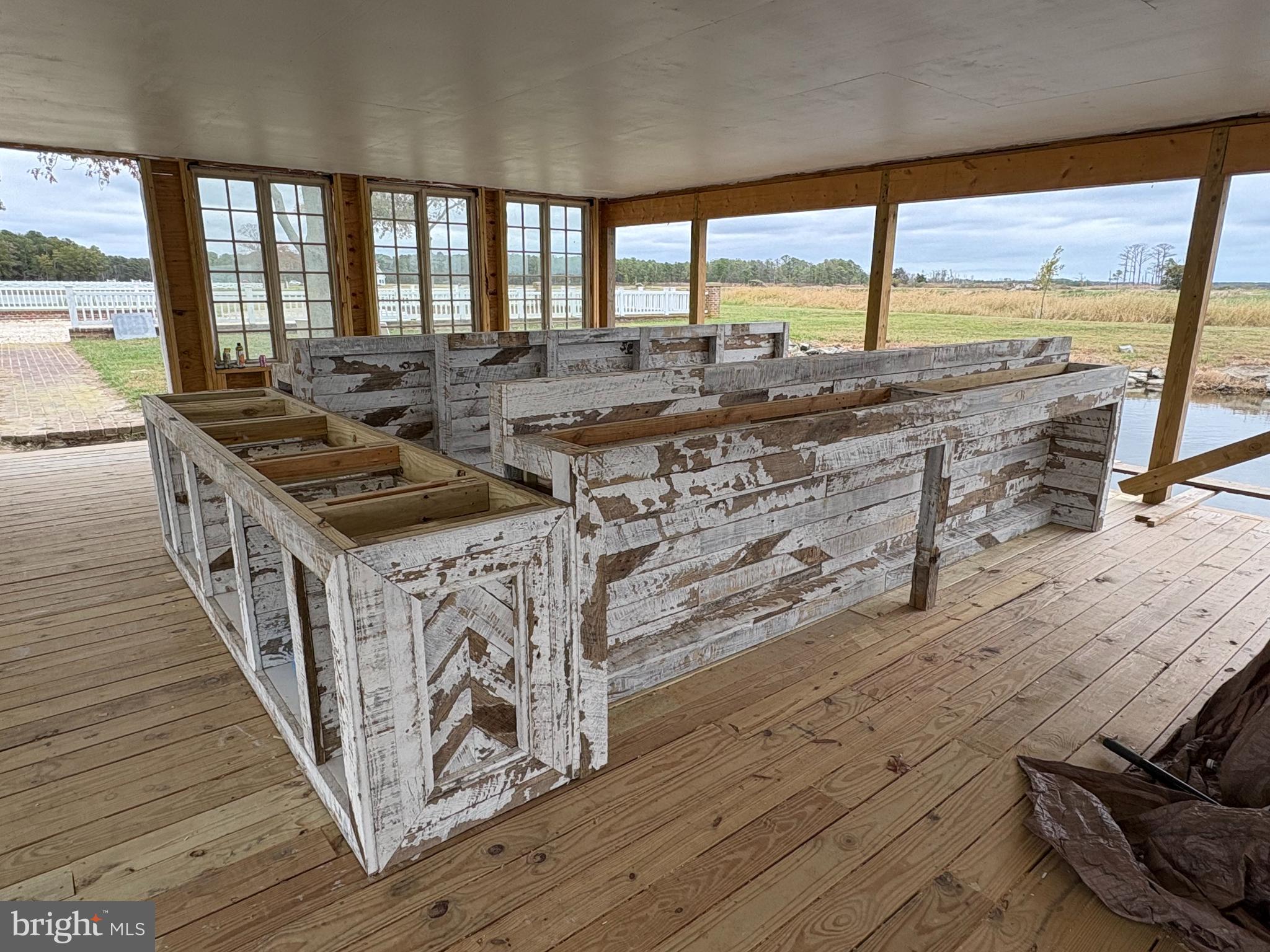 964 Taylors Island Road Madison, MD 21648 - Photo 100 of 106 a kitchen with stainless steel appliances granite countertop a stove a sink and a wooden floors