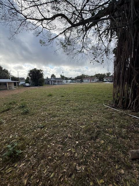 4583 Diekhans Road West Palm Beach, FL 33417 - Photo 5 of 6 a view of a field with large trees