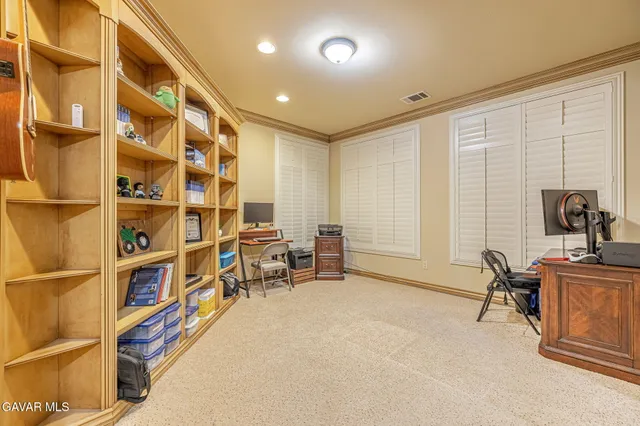 a kitchen with kitchen island granite countertop lots of counter top space and stainless steel appliances