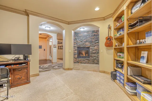 a kitchen with stainless steel appliances granite countertop a refrigerator a sink and a stove